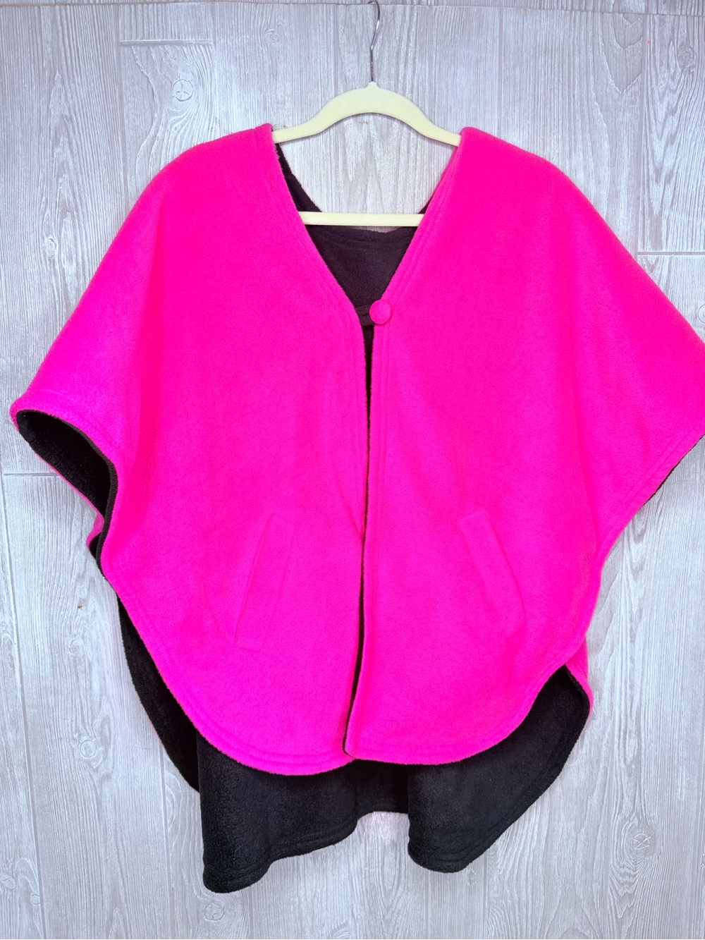 Pink and black reversible button front felt style poncho / jacket with pockets